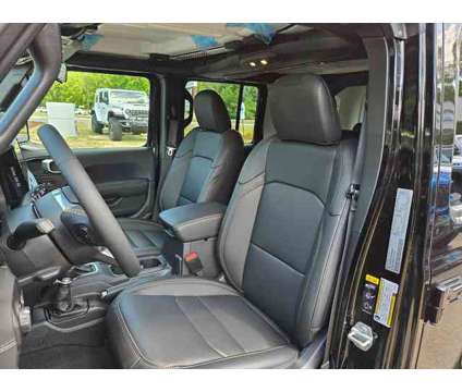 2024 Jeep Wrangler 4xe Sahara 4xe is a Black 2024 Jeep Wrangler SUV in Freehold NJ