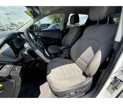 2016 Hyundai Santa Fe Sport 2.4L is a White 2016 Hyundai Santa Fe Sport 2.4L SUV in Dodge City KS