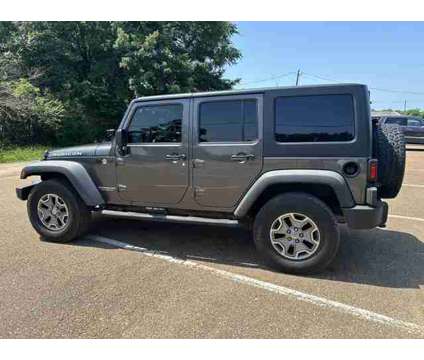 2014 Jeep Wrangler for sale is a Grey 2014 Jeep Wrangler Car for Sale in Olive Branch MS