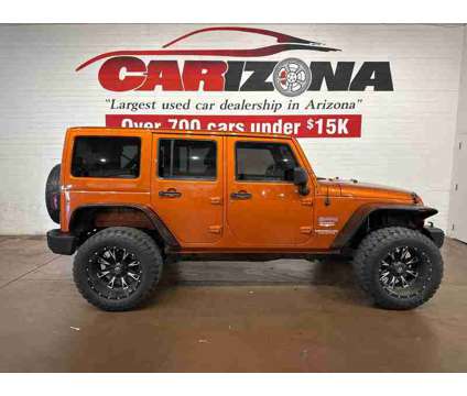 2011 Jeep Wrangler Unlimited Sahara is a Yellow 2011 Jeep Wrangler Unlimited Sahara SUV in Chandler AZ