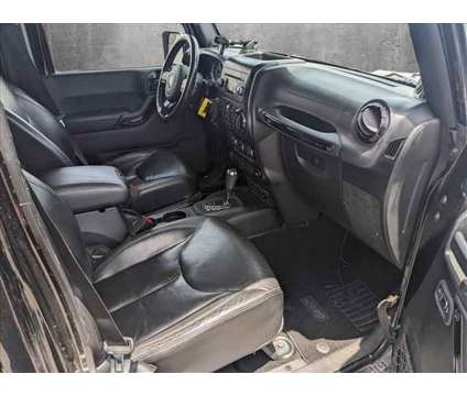 2014 Jeep Wrangler Unlimited Altitude is a Black 2014 Jeep Wrangler Unlimited Altitude SUV in Valencia CA