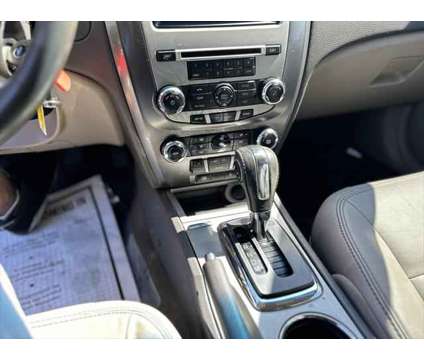 2012 Ford Fusion SEL is a Red 2012 Ford Fusion SEL Sedan in Lincolnwood IL