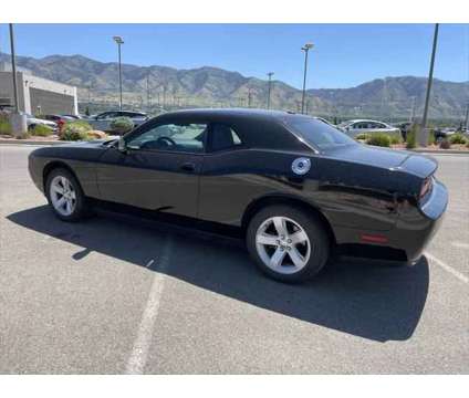 2014 Dodge Challenger SXT is a Black 2014 Dodge Challenger SXT Coupe in Logan UT