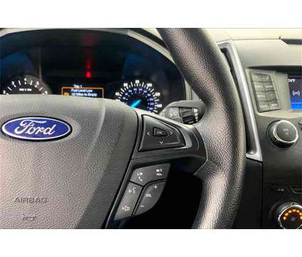 2017 Ford Edge SE is a Black 2017 Ford Edge SE SUV in Madison WI