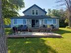 Alpena 5BR 2BA, Welcome to your dream lakeside retreat on