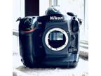 Nikon USA D4 Professional DSLR camera body only with 2 batteries and charger