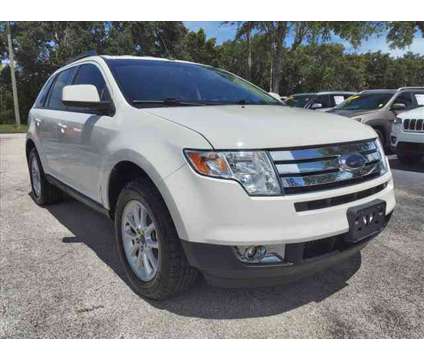 2010 Ford Edge SEL is a Silver, White 2010 Ford Edge SEL Car for Sale in Cocoa FL