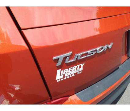 2016 Hyundai Tucson SE is a Orange 2016 Hyundai Tucson SE Car for Sale in Mahwah NJ