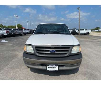 2003 Ford F-150 XLT is a White 2003 Ford F-150 XLT Truck in Council Bluffs IA