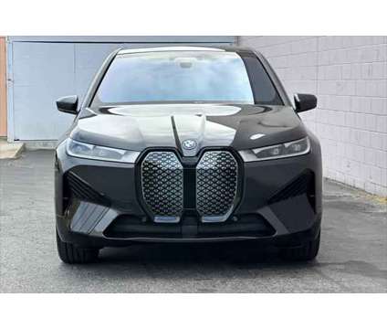 2025 BMW iX xDrive50 is a Grey 2025 BMW 325 Model iX SUV in Seaside CA