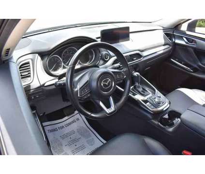 2021 Mazda CX-9 Touring is a Black 2021 Mazda CX-9 Touring SUV in Lawrence KS