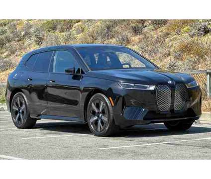 2025 BMW iX xDrive50 is a Black 2025 BMW 325 Model iX SUV in Seaside CA