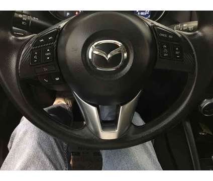 2016 Mazda CX-5 Sport is a White 2016 Mazda CX-5 Sport SUV in Waterloo IA