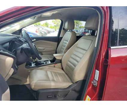 2017 Ford Escape Titanium is a Red 2017 Ford Escape Titanium SUV in Orlando FL
