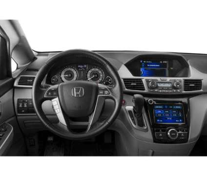 2014 Honda Odyssey EX-L is a 2014 Honda Odyssey EX Van in Evansville IN