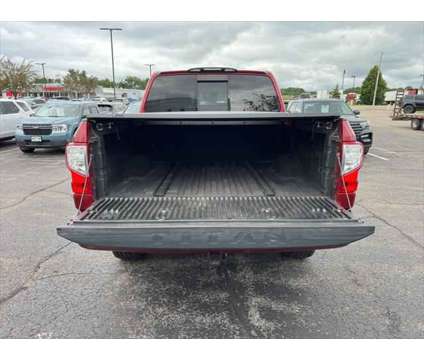 2017 Nissan Titan SV is a Red 2017 Nissan Titan SV Truck in Stevens Point WI