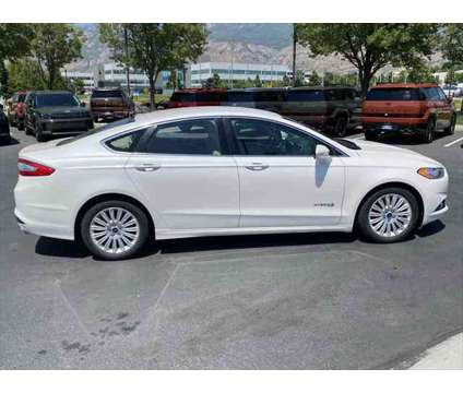 2013 Ford Fusion Hybrid SE is a Silver, White 2013 Ford Fusion Hybrid SE Hybrid in Lindon UT