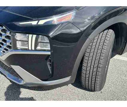 2021 Hyundai Santa Fe SEL is a Black 2021 Hyundai Santa Fe SE SUV in Stuart FL