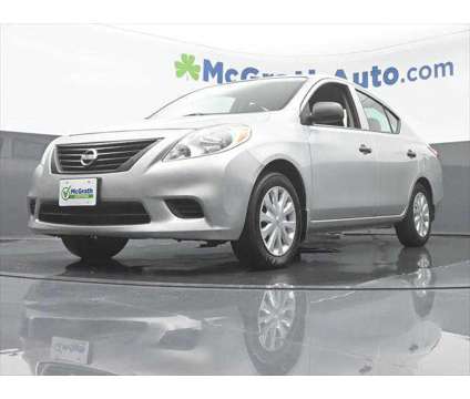 2014 Nissan Versa 1.6 S is a Silver 2014 Nissan Versa 1.6 Trim Sedan in Dubuque IA