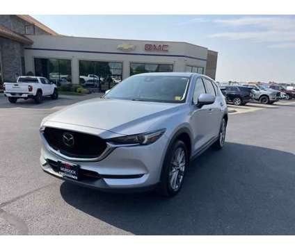 2021 Mazda CX-5 Grand Touring is a Silver 2021 Mazda CX-5 Grand Touring SUV in Logan UT