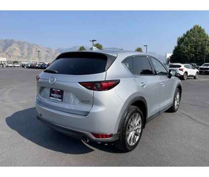 2021 Mazda CX-5 Grand Touring is a Silver 2021 Mazda CX-5 Grand Touring SUV in Logan UT