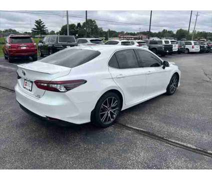 2021 Toyota Camry XLE Hybrid is a White 2021 Toyota Camry XLE Hybrid in Dubuque IA