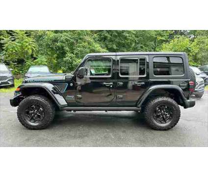 2023 Jeep Wrangler 4xe Rubicon 20th Anniversary 4x4 is a Black 2023 Jeep Wrangler SUV in Danbury CT