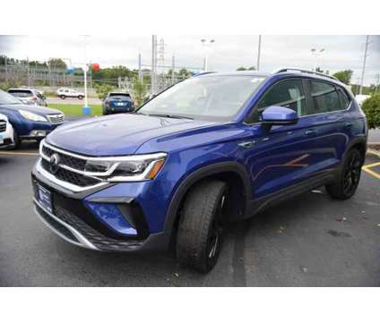 2024 Volkswagen Taos 1.5T SEL is a Blue 2024 SUV in Highland Park IL