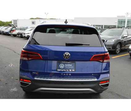 2024 Volkswagen Taos 1.5T SEL is a Blue 2024 SUV in Highland Park IL