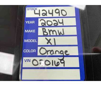 2024 BMW X1 xDrive28i is a Orange 2024 BMW X1 xDrive 28i SUV in Erie PA