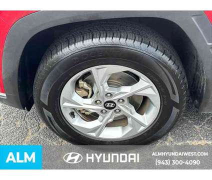 2022 Hyundai Tucson SEL is a Red 2022 Hyundai Tucson SUV in Lithia Springs GA