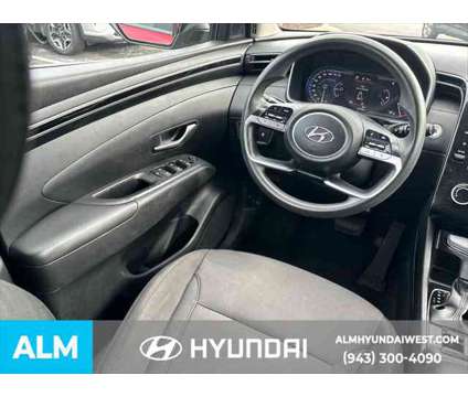 2022 Hyundai Tucson SEL is a Red 2022 Hyundai Tucson SUV in Lithia Springs GA