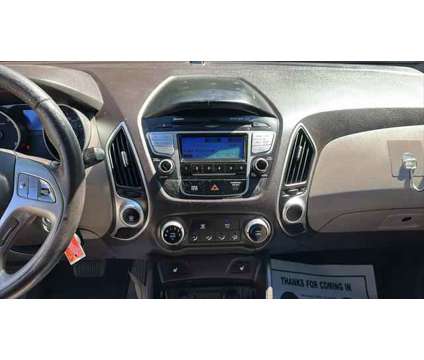 2013 Hyundai Tucson GLS is a Blue 2013 Hyundai Tucson GLS SUV in Danbury CT