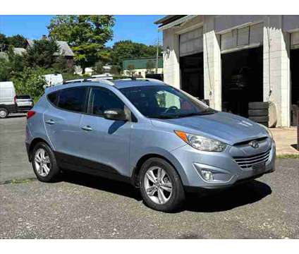 2013 Hyundai Tucson GLS is a Blue 2013 Hyundai Tucson GLS SUV in Danbury CT