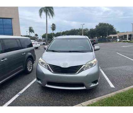 2014 Toyota Sienna LE is a Silver 2014 Toyota Sienna LE Car for Sale in Orlando FL