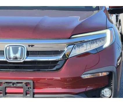 2019 Honda Pilot Touring is a Red 2019 Honda Pilot Touring SUV in Brunswick OH