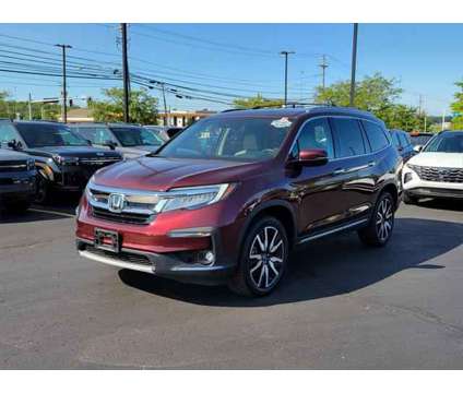 2019 Honda Pilot Touring is a Red 2019 Honda Pilot Touring SUV in Brunswick OH