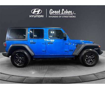 2024 Jeep Wrangler 4-Door Sport 4x4 is a Blue 2024 Jeep Wrangler SUV in Streetsboro OH