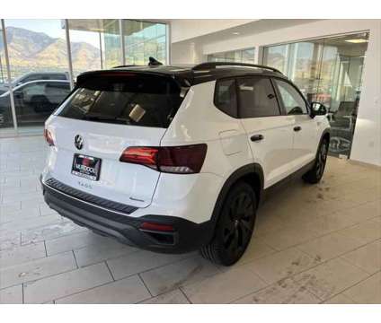 2024 Volkswagen Taos 1.5T SE is a White 2024 SUV in Logan UT