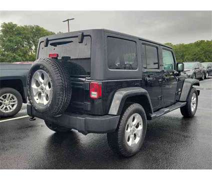 2014 Jeep Wrangler Unlimited Sahara is a Black 2014 Jeep Wrangler Unlimited Sahara SUV in Mechanicsburg PA