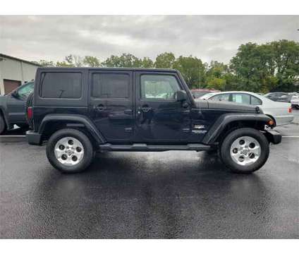 2014 Jeep Wrangler Unlimited Sahara is a Black 2014 Jeep Wrangler Unlimited Sahara SUV in Mechanicsburg PA