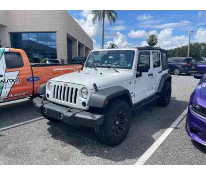 2017 Jeep Wrangler Unlimited Sport is a White 2017 Jeep Wrangler Unlimited Car for Sale in Orlando FL