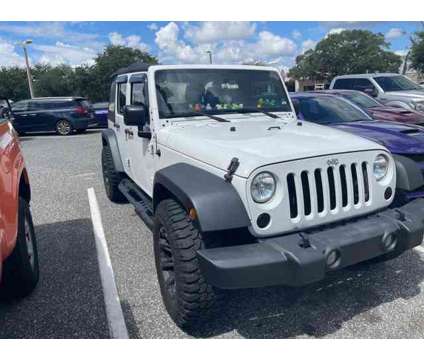 2017 Jeep Wrangler Unlimited Sport is a White 2017 Jeep Wrangler Unlimited Car for Sale in Orlando FL