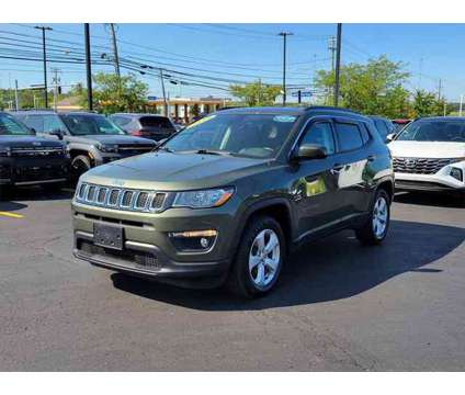 2018 Jeep Compass Latitude FWD is a Green 2018 Jeep Compass Latitude SUV in Brunswick OH