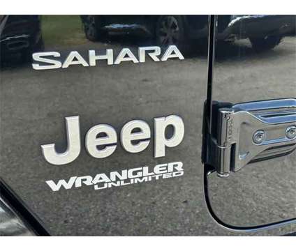 2018 Jeep Wrangler Unlimited Sahara 4x4 is a Black 2018 Jeep Wrangler Unlimited Sahara SUV in Meridian MS