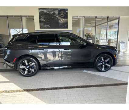 2025 BMW iX xDrive50 is a Grey 2025 BMW 325 Model iX SUV in Westbrook ME