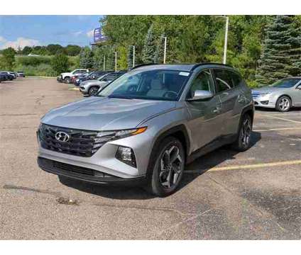 2024 Hyundai Tucson SEL is a Silver 2024 Hyundai Tucson SUV in New Hudson MI