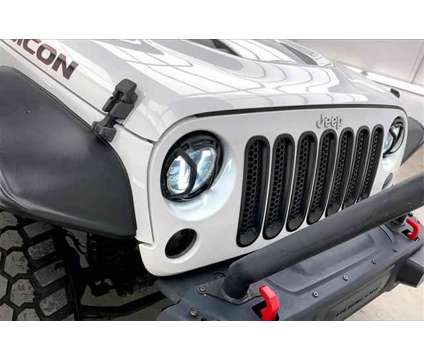 2016 Jeep Wrangler Unlimited Rubicon Hard Rock is a White 2016 Jeep Wrangler Unlimited Rubicon SUV in Madison WI