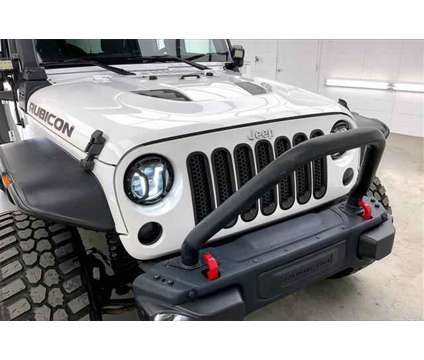 2016 Jeep Wrangler Unlimited Rubicon Hard Rock is a White 2016 Jeep Wrangler Unlimited Rubicon SUV in Madison WI