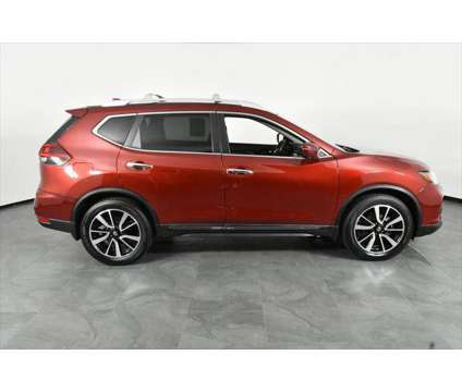 2019 Nissan Rogue SL is a Red 2019 Nissan Rogue SL Station Wagon in Orlando FL